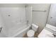 Bathroom featuring white fixtures, including a tub-shower combo, toilet, and a vanity with a mirror at 1400 Wessex Ct, Monroe, NC 28110