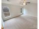 Spacious bedroom featuring neutral carpet, ceiling fan and natural light at 1400 Wessex Ct, Monroe, NC 28110