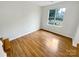 Cozy bedroom with hardwood floors, natural light, and neutral paint at 1400 Wessex Ct, Monroe, NC 28110