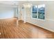 Bright dining area with hardwood floors, stylish chandelier, and large window overlooking the front yard at 1400 Wessex Ct, Monroe, NC 28110