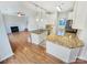 Open-concept kitchen featuring island with granite countertops, seamlessly connected to the living area at 1400 Wessex Ct, Monroe, NC 28110