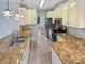 Galley kitchen with stainless steel appliances, granite counters, and a stainless sink at 1400 Wessex Ct, Monroe, NC 28110