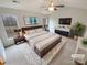 Spacious main bedroom with a king bed, ceiling fan, and ample natural light at 1400 Wessex Ct, Monroe, NC 28110