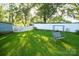 Lush backyard with green lawn, privacy fence and swing set, perfect for outdoor relaxation at 142 Wilson Ne St, Concord, NC 28025