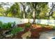 Secluded backyard featuring a serene pond, lush foliage, and stone accents at 142 Wilson Ne St, Concord, NC 28025