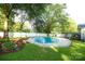 Beautiful backyard oasis featuring a sparkling in-ground pool and landscaped surroundings at 142 Wilson Ne St, Concord, NC 28025