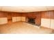 Spacious finished basement with brick fireplace and access to unfinished space at 142 Wilson Ne St, Concord, NC 28025