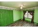 Inviting bedroom featuring wood-look floors, closet, ceiling fan, and ample natural light at 142 Wilson Ne St, Concord, NC 28025