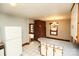 Spacious kitchen featuring white appliances, tile flooring, with a view into the adjacent dining and living areas at 142 Wilson Ne St, Concord, NC 28025