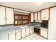 Functional kitchen with white cabinets, laminate countertops, and tile flooring, with essential appliances at 142 Wilson Ne St, Concord, NC 28025