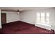 Bright living room featuring neutral paint, a ceiling fan, and a cozy window seat at 142 Wilson Ne St, Concord, NC 28025