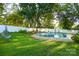 Backyard view of a refreshing in-ground pool, set in a beautifully landscaped yard at 142 Wilson Ne St, Concord, NC 28025