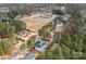 Aerial view of the property showcasing its location within a community with various amenities and green spaces at 147 Belfry Loop, Mooresville, NC 28117