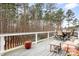 Enjoy outdoor living on this large deck with comfortable seating and picturesque wooded views at 147 Belfry Loop, Mooresville, NC 28117