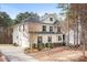 Spacious two-story home featuring a brick and siding exterior with a wide driveway and two-car garage at 147 Belfry Loop, Mooresville, NC 28117