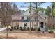 Charming two-story home with a stone and brick exterior and beautifully landscaped front yard at 147 Belfry Loop, Mooresville, NC 28117