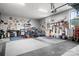 Spacious garage with epoxy flooring, ample storage, and room for multiple motorcycles, perfect for car enthusiasts and hobbyists at 147 Belfry Loop, Mooresville, NC 28117