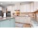 Charming kitchen with granite countertops and stainless steel appliances at 147 Belfry Loop, Mooresville, NC 28117