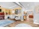 Inviting living room with hardwood floors, piano, and comfortable seating at 147 Belfry Loop, Mooresville, NC 28117
