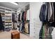 Spacious walk-in closet with custom shelving, cabinets, and plenty of hanging space for organized storage at 147 Belfry Loop, Mooresville, NC 28117