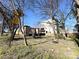 View of house with yard and neighboring apartment complex on a sunny day at 1600 Julia Maulden Pl, Charlotte, NC 28206