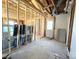 A room being renovated with exposed framework and new windows ready for installation at 1600 Julia Maulden Pl, Charlotte, NC 28206