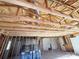 Spacious interior view with exposed wood beams and visible framing, showcasing a work in progress at 1600 Julia Maulden Pl, Charlotte, NC 28206