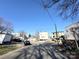 View of house from the street with neighbor properties, cars, and overhead utility wires at 1600 Julia Maulden Pl, Charlotte, NC 28206