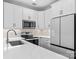 Modern kitchen with stainless steel appliances, white cabinets, and granite countertops at 163 Singleton Rd, Mooresville, NC 28117