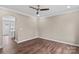 A bright living room flows into a kitchen area, complete with hardwood floors and neutral colors at 163 Singleton Rd, Mooresville, NC 28117