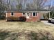 Charming brick ranch home with a covered carport and well-maintained front yard at 177 Valleydale Dr, Gastonia, NC 28056