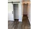 Hallway features new flooring and trim, with a modern barn door to adjacent space at 177 Valleydale Dr, Gastonia, NC 28056