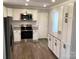 Renovated kitchen featuring stainless steel appliances, granite countertops, and ample cabinet space at 177 Valleydale Dr, Gastonia, NC 28056