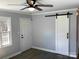 Living area with modern ceiling fan, stylish barn door and durable flooring at 177 Valleydale Dr, Gastonia, NC 28056