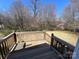 Inviting backyard view from a wooden deck surrounded by mature trees at 188 13Th Se St, Hickory, NC 28602