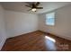 Bright bedroom features hardwood floors, a ceiling fan, and a window with natural light at 188 13Th Se St, Hickory, NC 28602