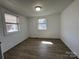 Bedroom with natural light and two windows that brighten the space, also showing light vinyl floors at 188 13Th Se St, Hickory, NC 28602