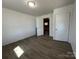 Bedroom view featuring light hard surface floors, and bright white doors and trim at 188 13Th Se St, Hickory, NC 28602