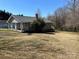 Cozy single-Gathering home with gray siding, a brick chimney, and a spacious yard with mature trees at 188 13Th Se St, Hickory, NC 28602