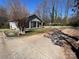 Charming home features a covered front porch with classic columns and a spacious front yard with mature trees at 188 13Th Se St, Hickory, NC 28602