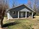 Charming single-story home featuring a covered front porch with classic white columns and gray siding at 188 13Th Se St, Hickory, NC 28602
