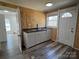 Galley kitchen with white cabinets, modern sink, durable floors, and natural light at 188 13Th Se St, Hickory, NC 28602