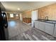 White and wood-stained cabinets flank durable floors in this open-concept kitchen at 188 13Th Se St, Hickory, NC 28602