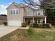 Charming two-story home featuring well-maintained landscaping and attached two-car garage at 1913 Leesburg Dr, Clover, SC 29710