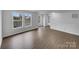 Well-lit living room featuring modern floors and windows, enhancing its welcoming atmosphere at 1913 Leesburg Dr, Clover, SC 29710