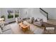 Bright, staged living room features modern furniture, neutral colors, and large windows at 1913 Leesburg Dr, Clover, SC 29710