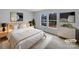 Calm staged main bedroom with large windows, neutral colors, and modern decorations at 1913 Leesburg Dr, Clover, SC 29710