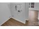 Functional utility room featuring plumbing fixtures, electrical outlets, and modern flooring at 1913 Leesburg Dr, Clover, SC 29710