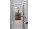 Bright bathroom with tiled floors, a wood vanity and framed mirror and a shower/tub combo at 2212 Yadkin Ave, Charlotte, NC 28205