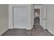 Bedroom with bi fold closet doors with neutral carpet and a view into the hallway at 242 Elrosa Rd, Mooresville, NC 28115